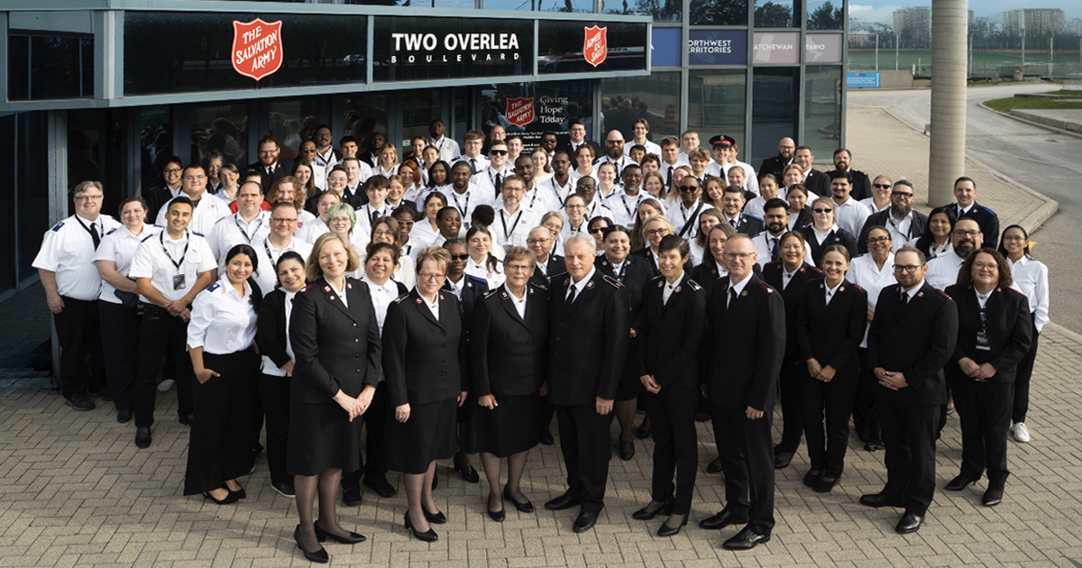 A large group of people in front of a building